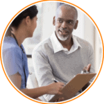1067448966-edit health-care-worker-talking-to-patient-image